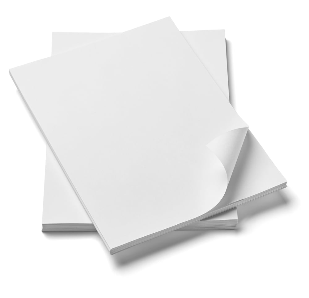 close up of stack of papers with curl on white background